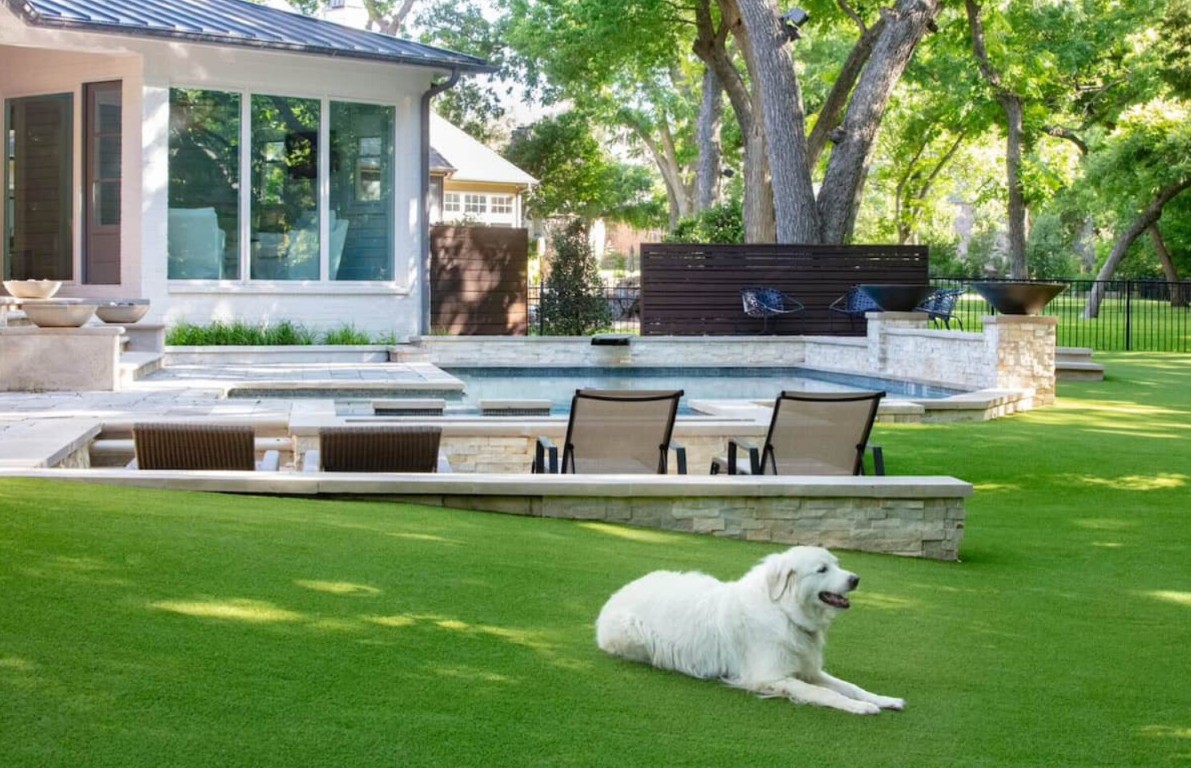 Beautiful backyard with artificial grass and pet dog in Auburn, AL